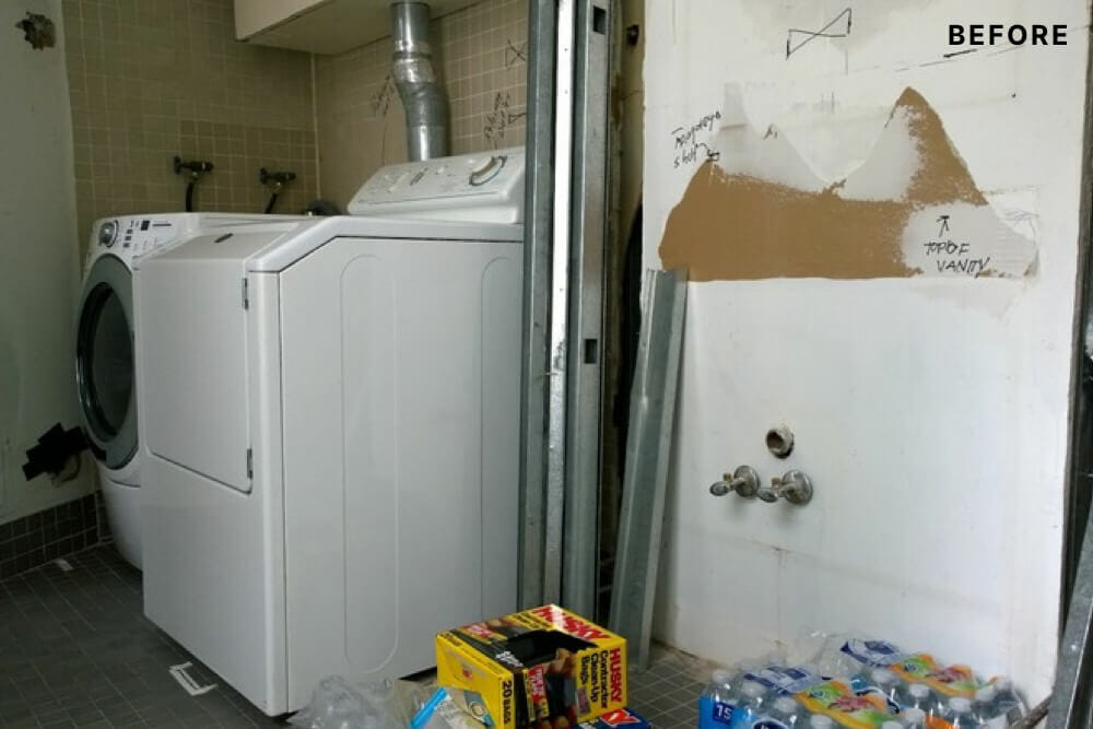 Washer dryer in a half bathroom space before renovation