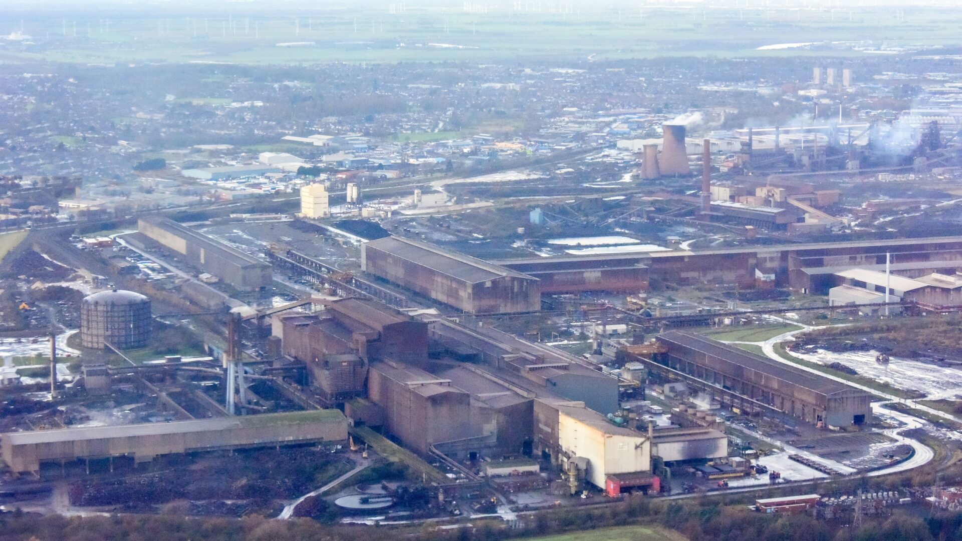 An enormous steel plant in the middle of Scunthorpe producing all sorts of large scale steel items, seen from above - a trade body is asking government to reach a resolution with British Steel