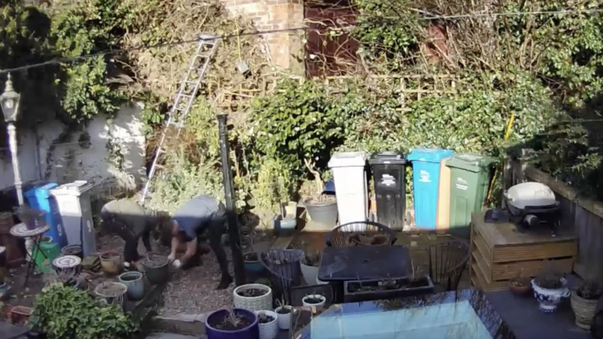 Doorbell camera captures workers disposing of asbestos in garden