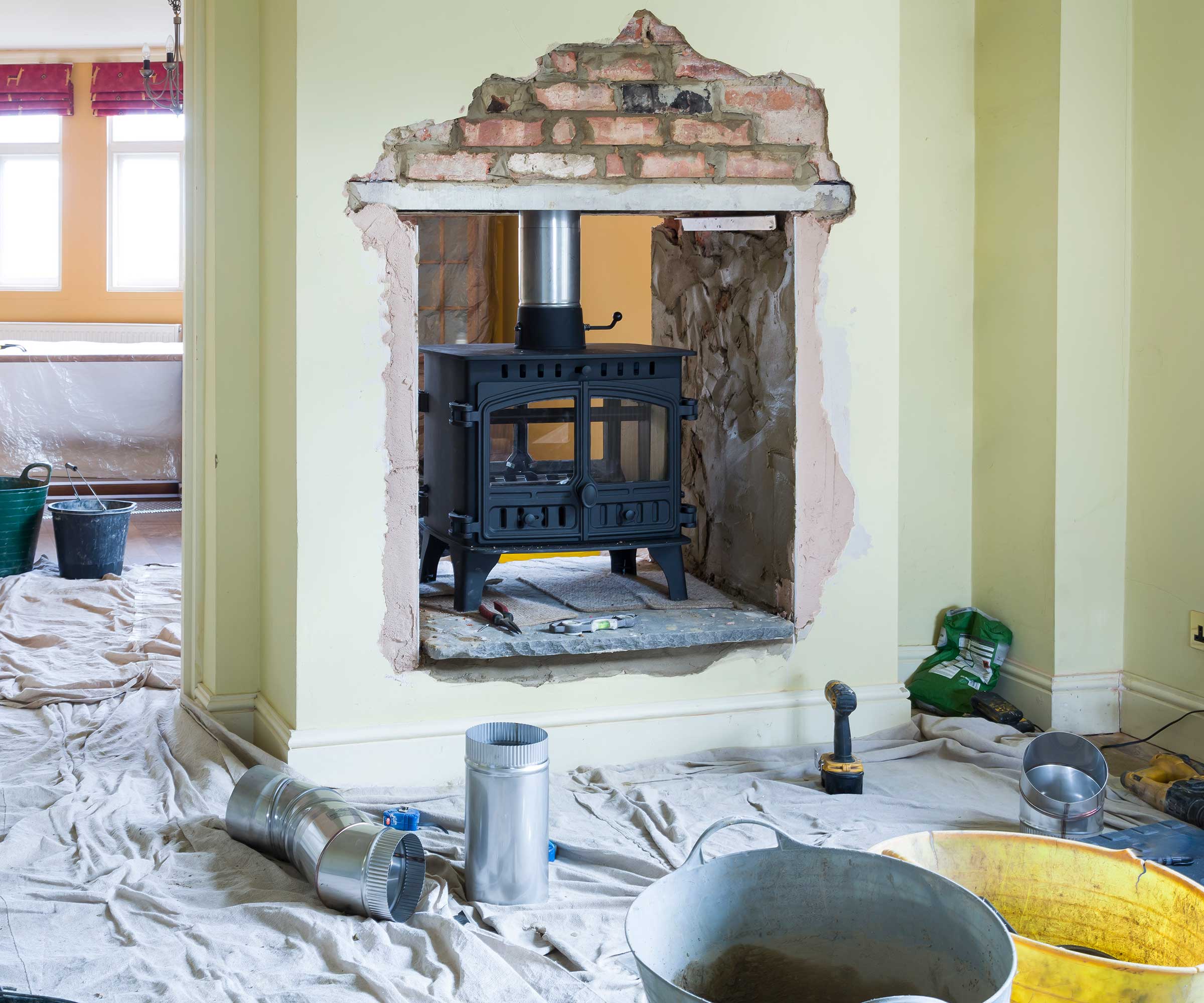 double sided fireplace with wood burning stove