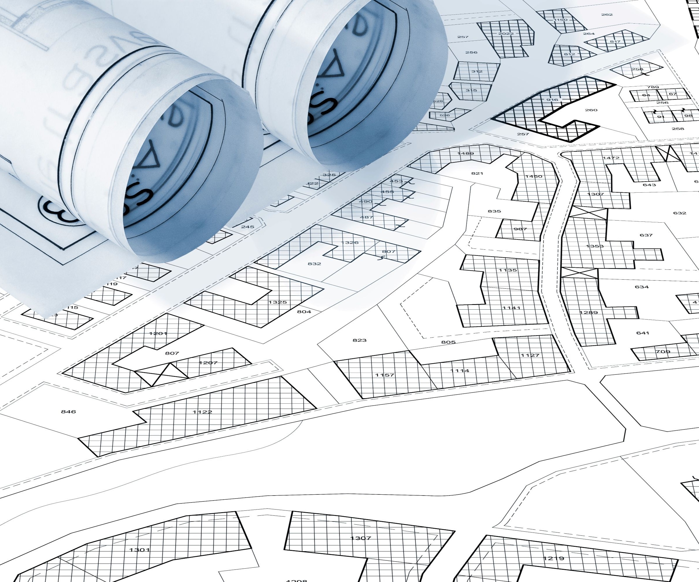 Papers with plans for houses drawn on them