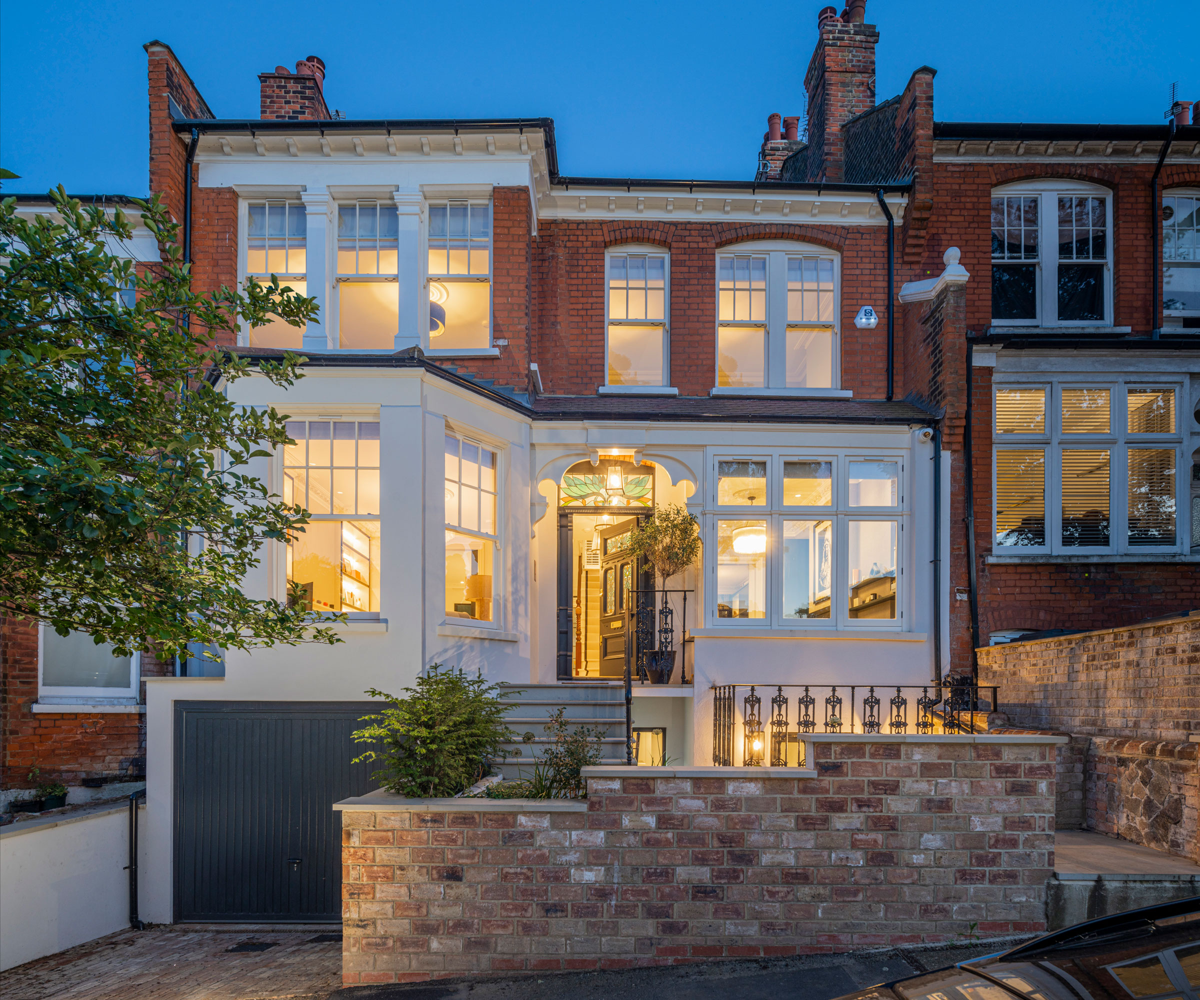 front garden design with brick wall and planting