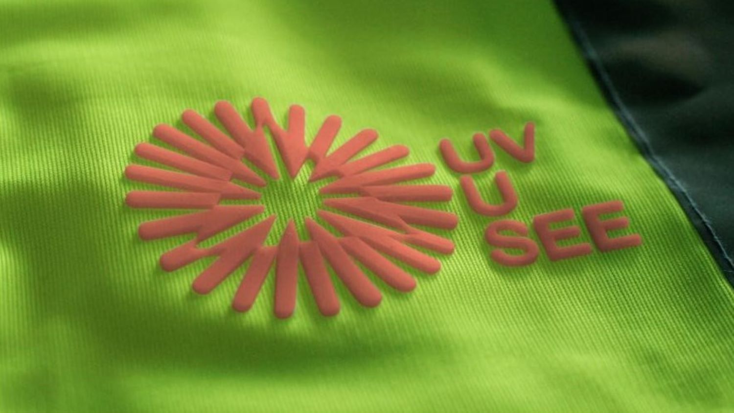 The UV-U-SEE silicon logo sits on a high vis vest and changes colour to pink as the sun’s UV level intensifies (image: CCS).