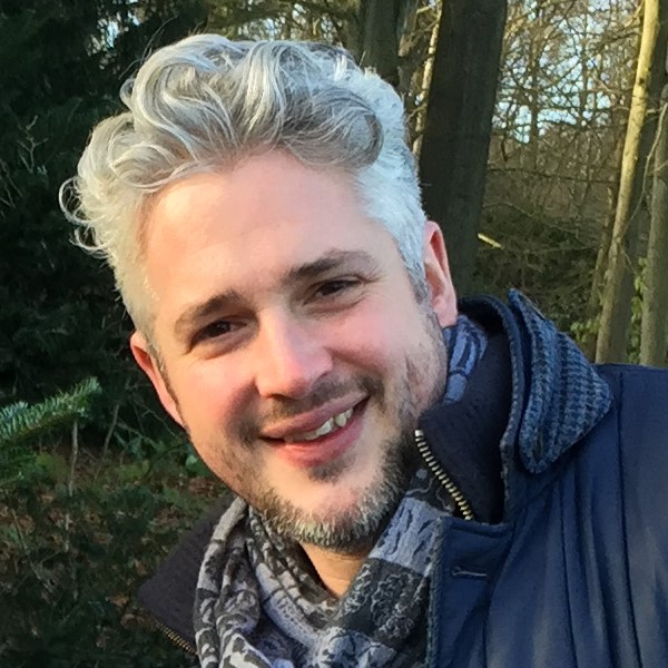 A headshot of Alex Main