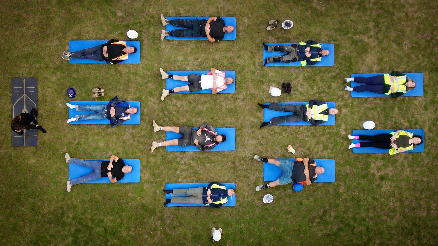 In pictures | Construction workers swap hard hats for yoga mats