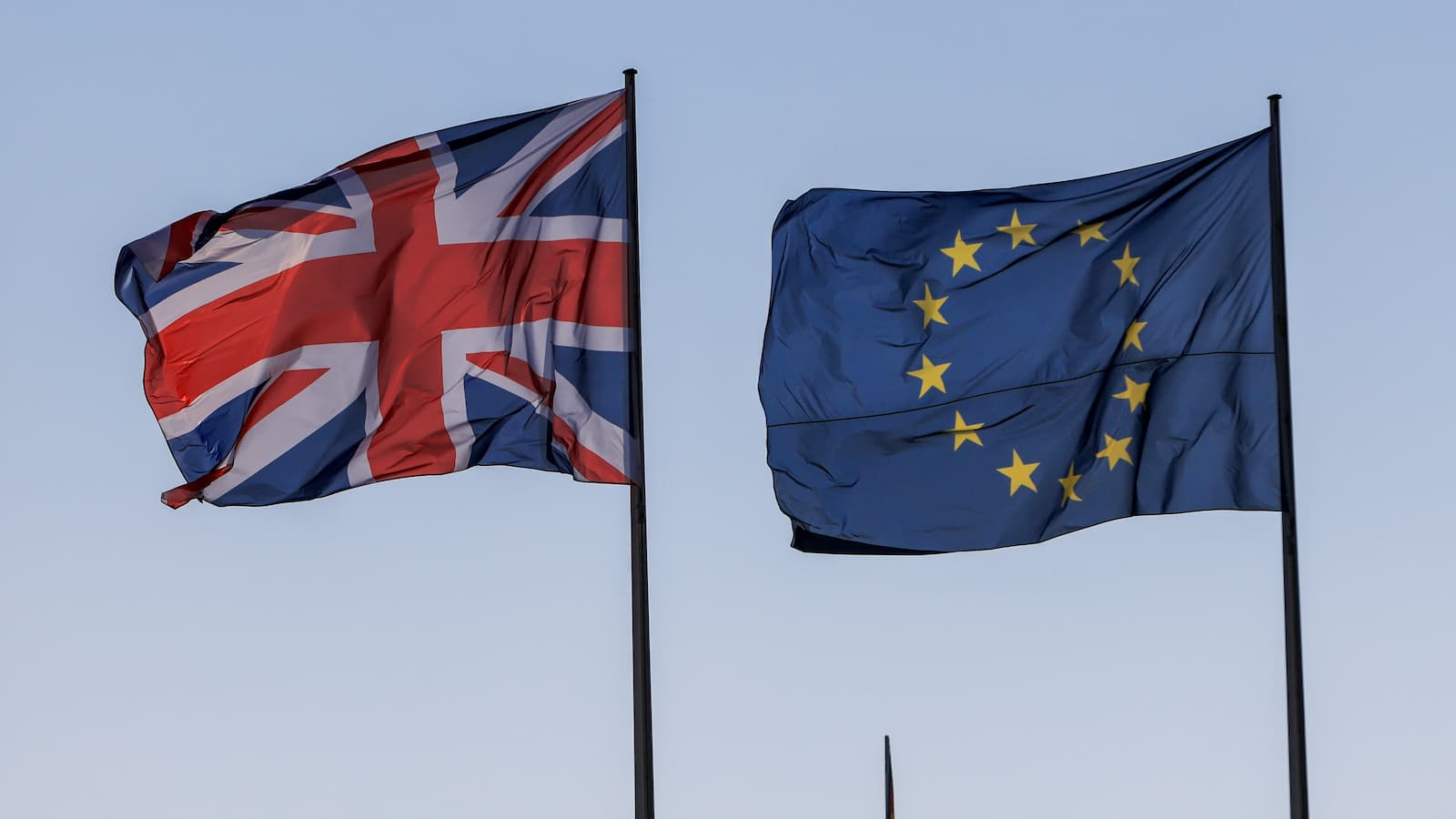 UK and EU flag blowing in the wind