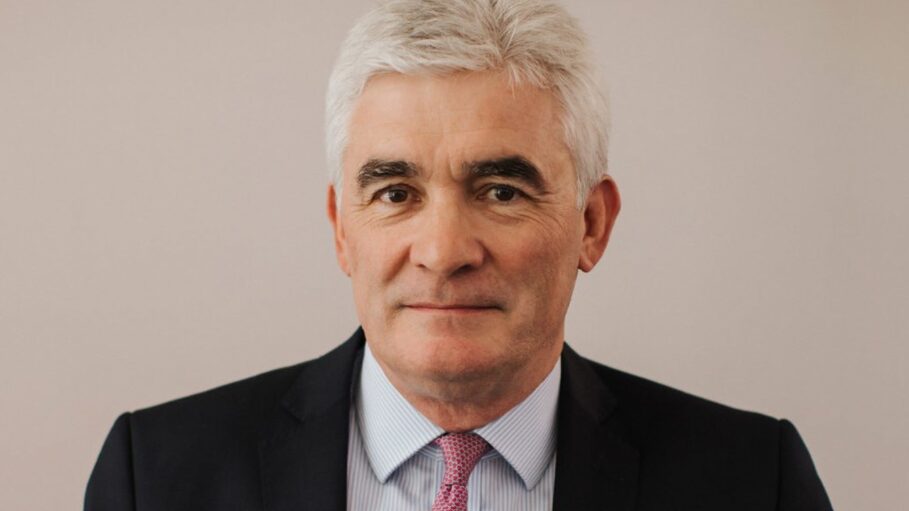Mugshot of a middle-aged man with tie and jacket looking at the camera - Andrew Davies is retiring as Kier