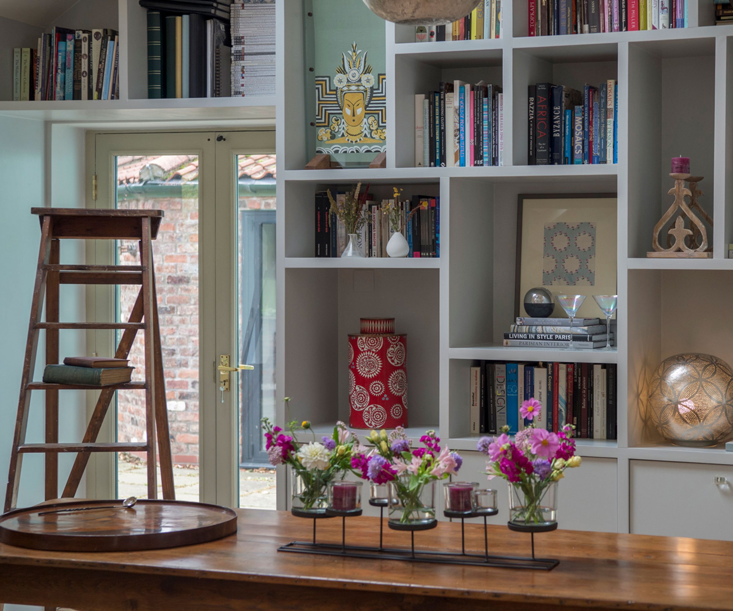wall of shelving with above door shelves