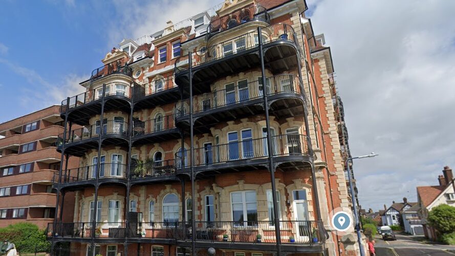 Front of a period luxury block of apartments against a blue sky. The developer and its director have been sentenced following serious fire safety failings.