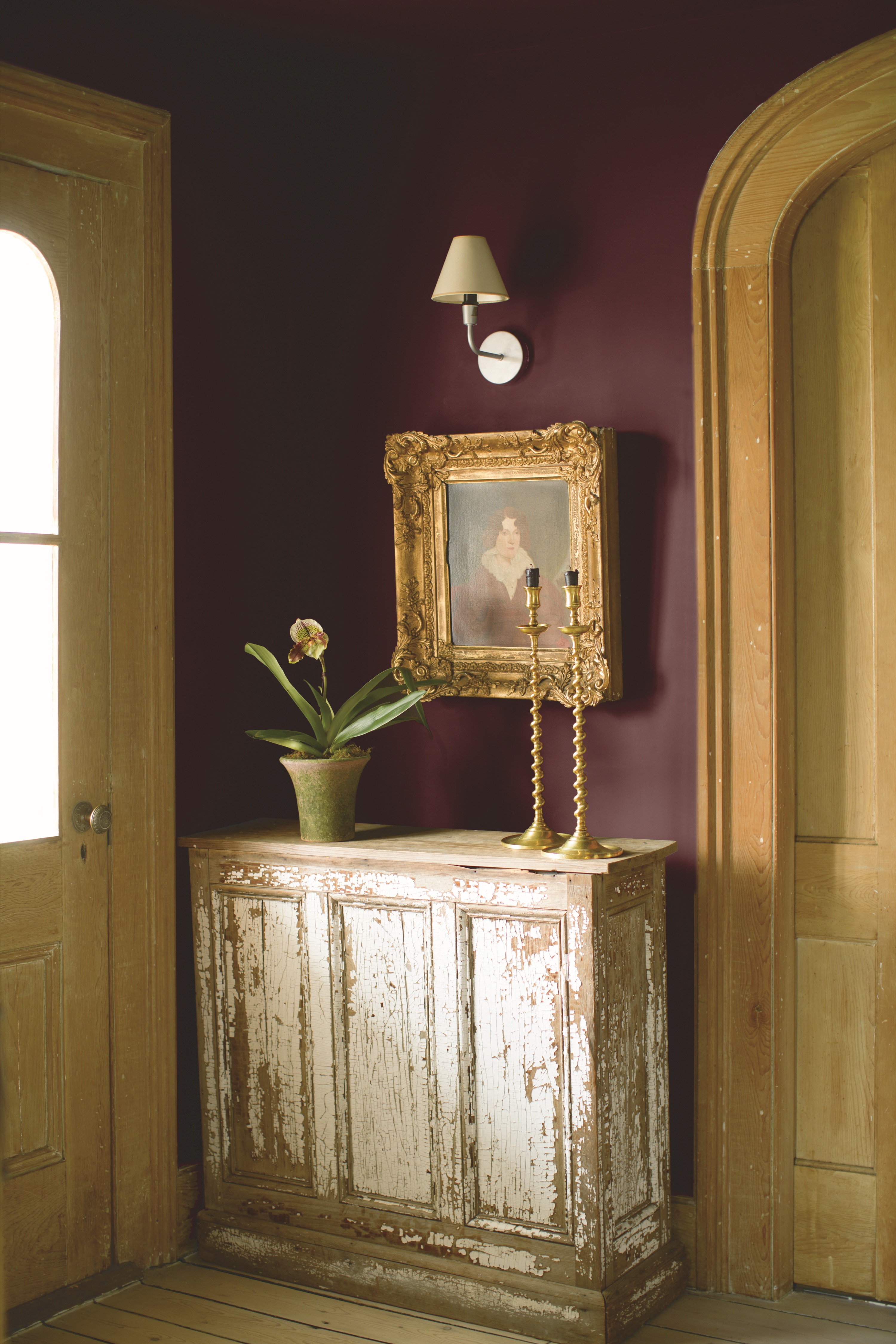 dark purple hallway with stone architrave