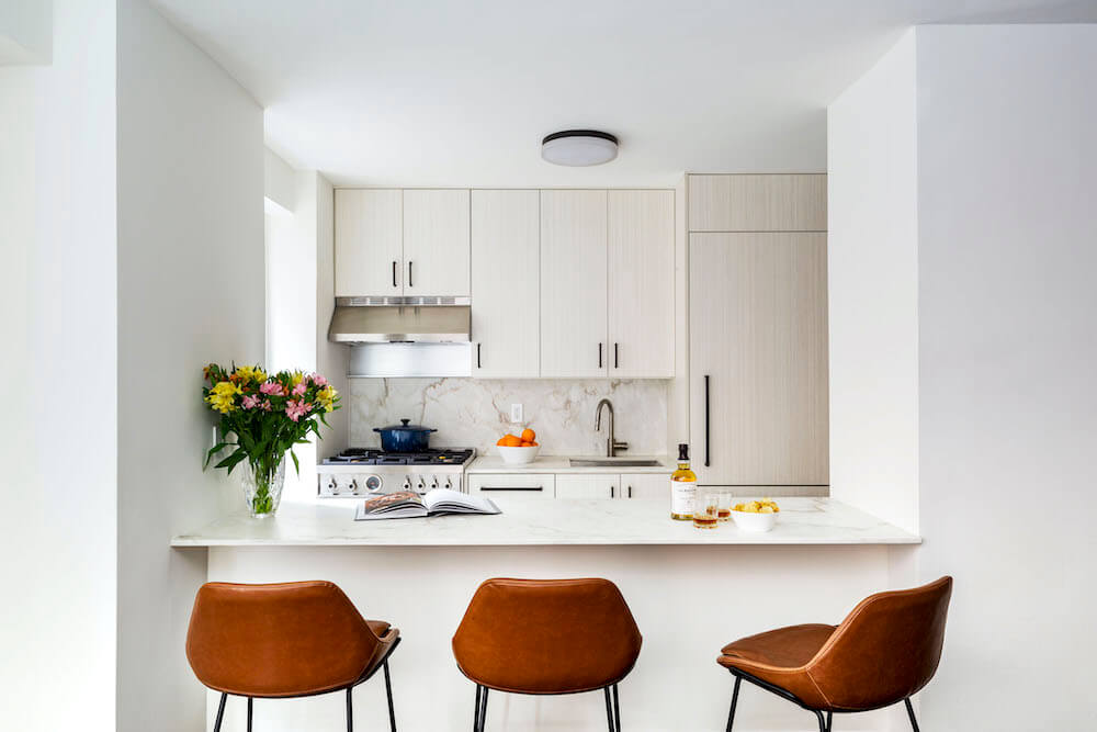 Image of a renovated kitchen with Calacatta marble backsplash