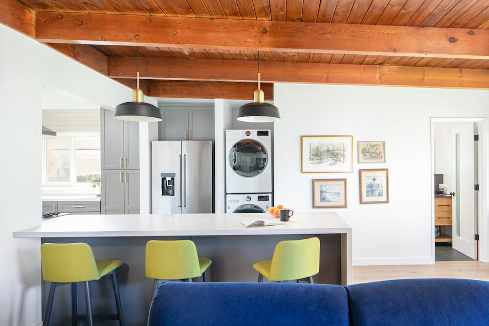 Image of a kitchen with peninsula and stacked washer dryer