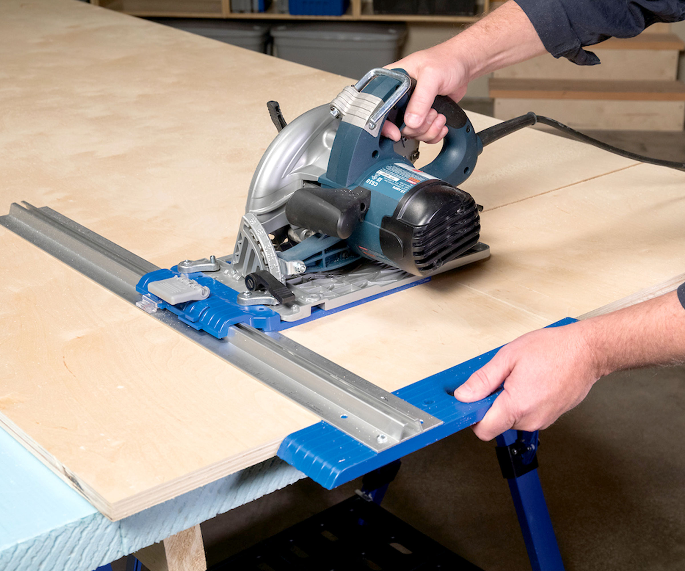 Kreg Rip-Cut Precision Edge-Guided Cutting Tool with circular saw cutting sheet of plywood