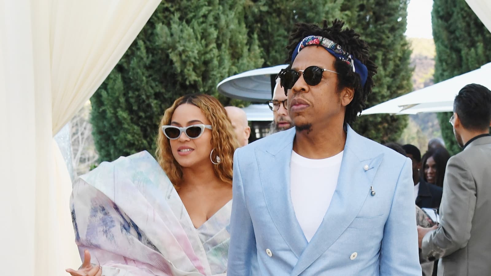 Beyonce and Jay-Z walking at a party