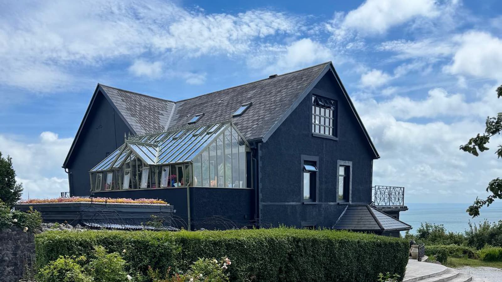 Homeowner puts bath in a greenhouse attached to their home
