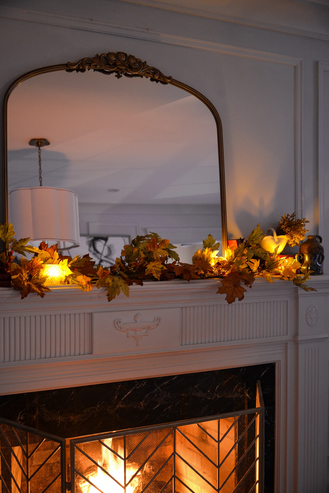 cozy traditional living room with fireplace mirror, anthro mirror dupe