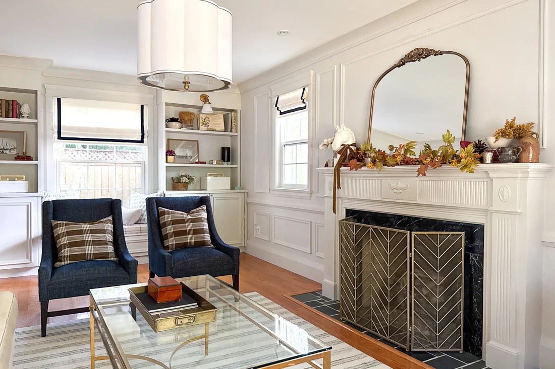 cozy traditional living room with fireplace, fall fireplace mantel decor