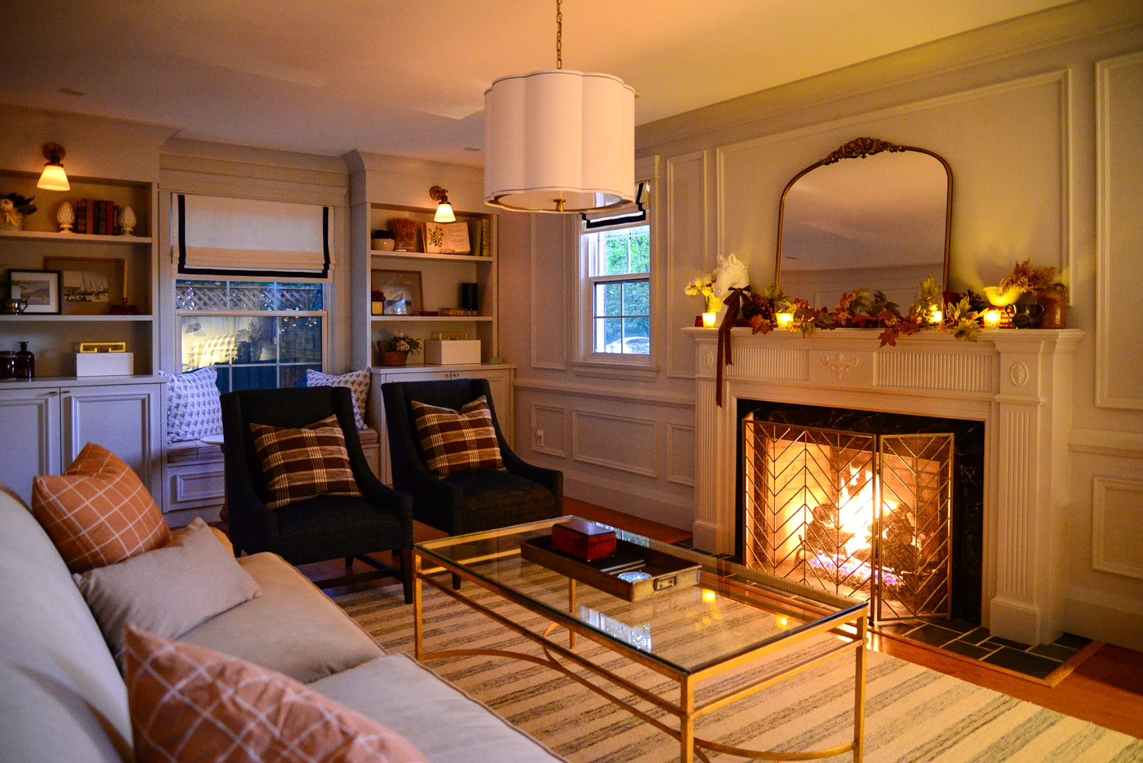 cozy living room fireplace with traditional decor, fireplace mantel fall garland