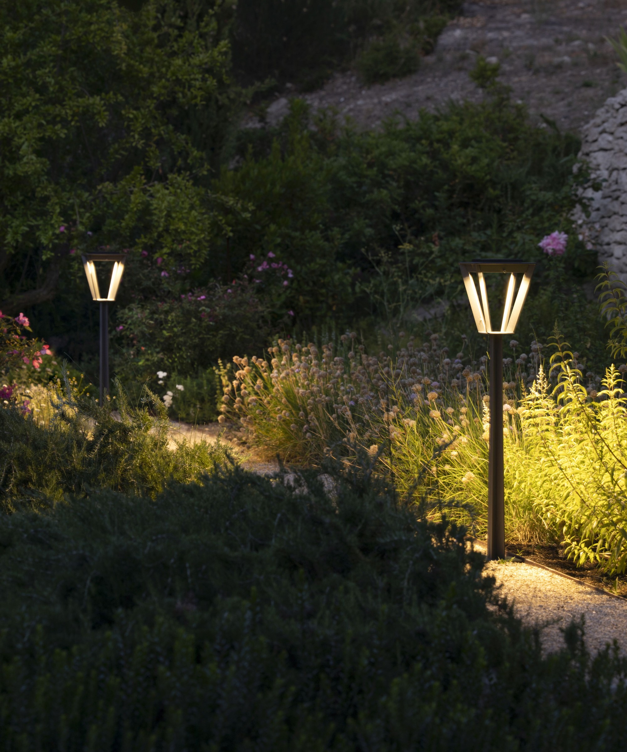 Solar floor lamps by Bridgman lighting up garden path