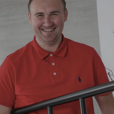 picture of heating expert John Klee wearing a red polo shirt