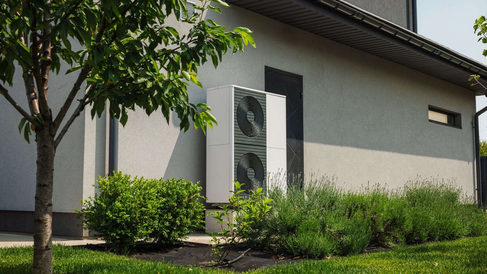 heat pump located on the side of a contemporary house