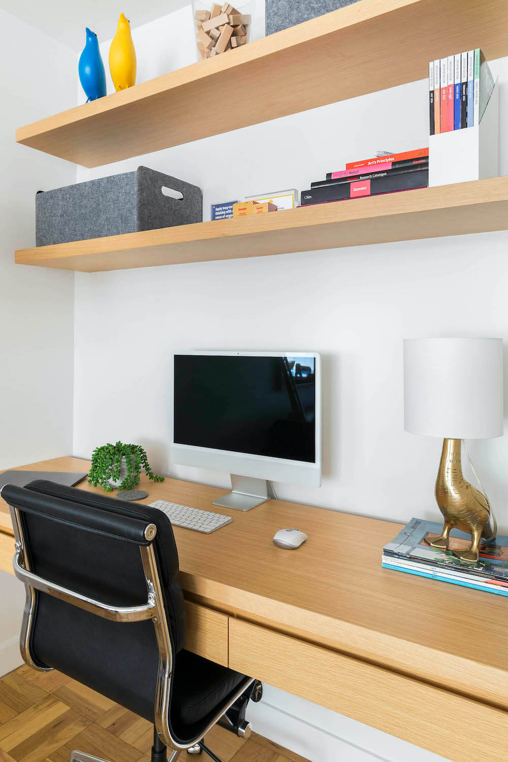 Home office with wood desk and open shelves