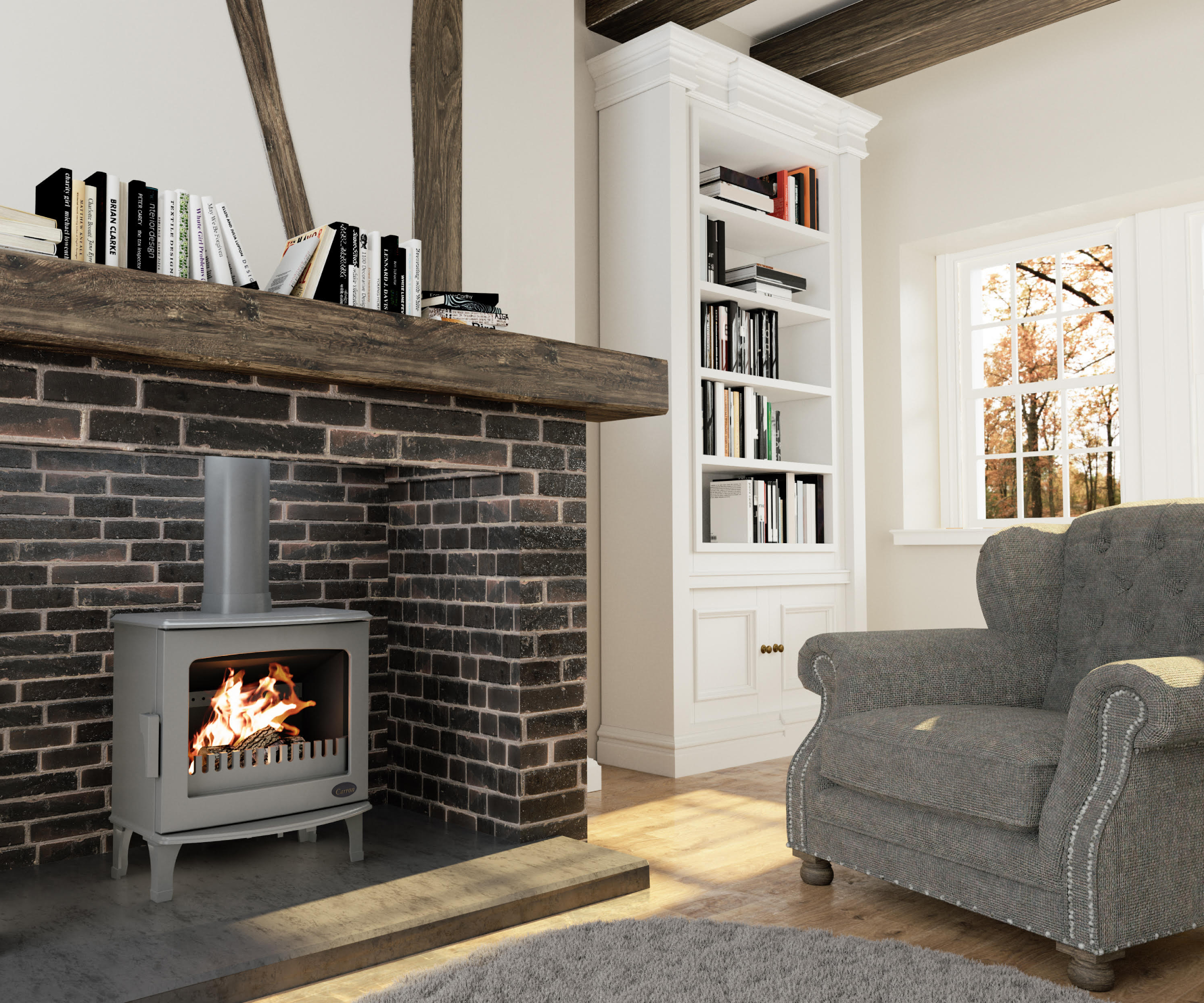 grey freestanding log burner in brick fireplace with wooden mantel and cosy grey armchair in front of fire