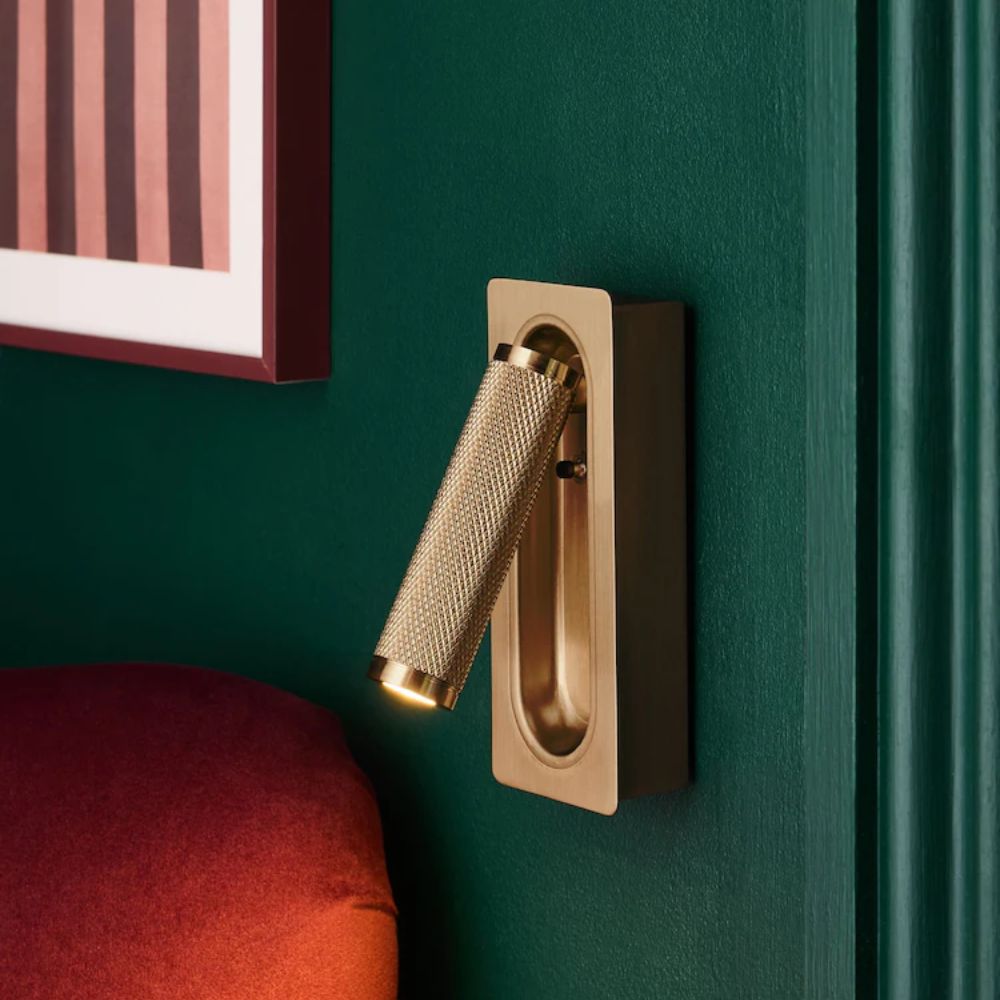 A brass rechargeable wall light