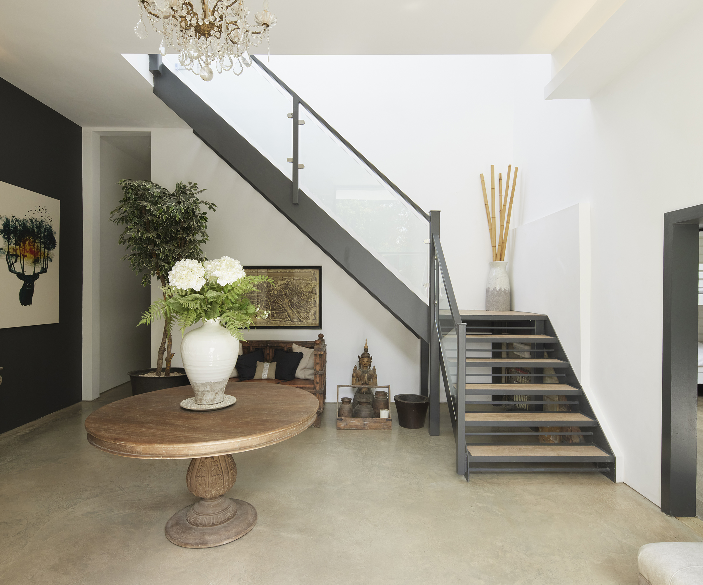 New staircase in a self build home with metal frame and glass panels