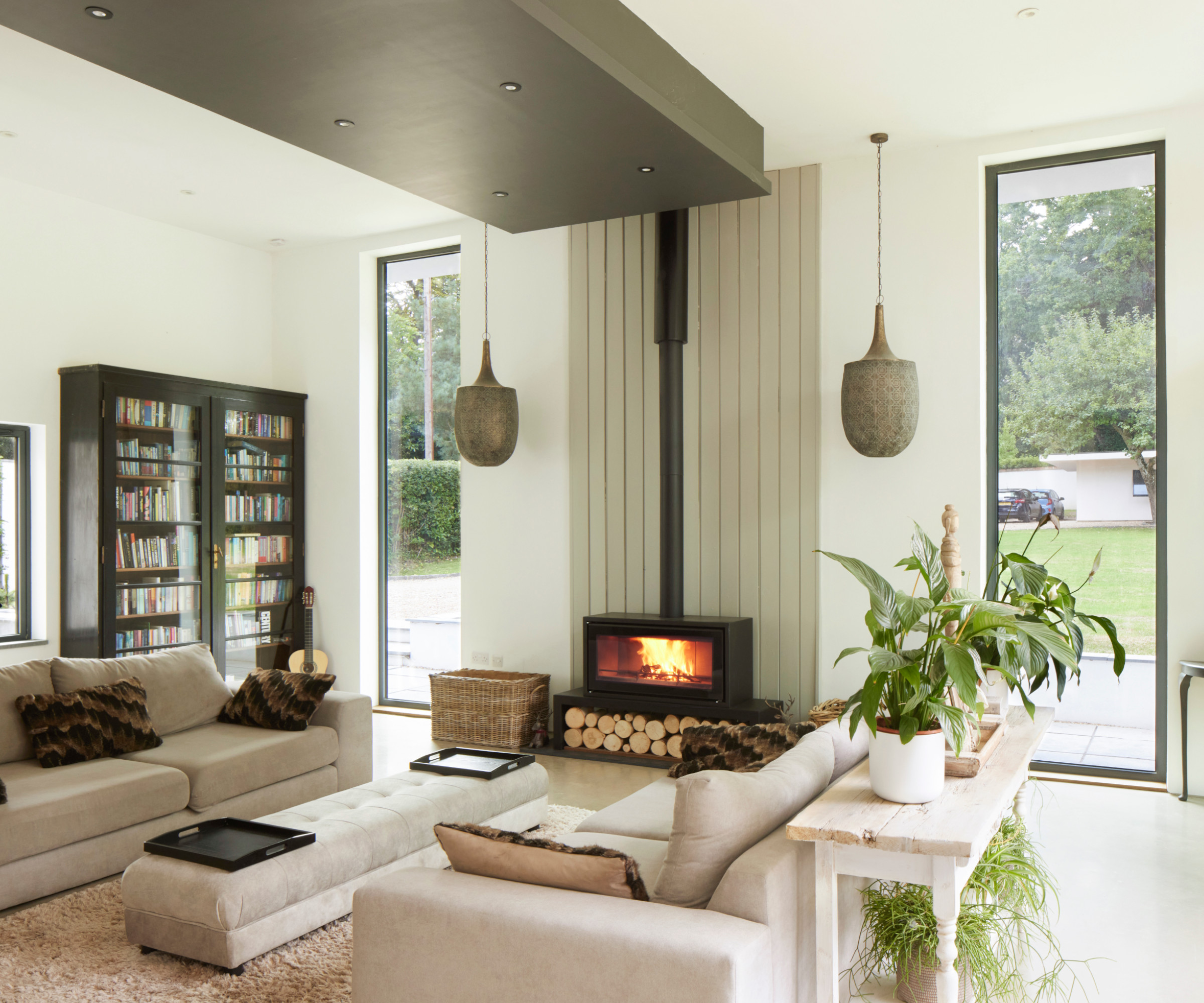 Living room with green ceiling and window accents
