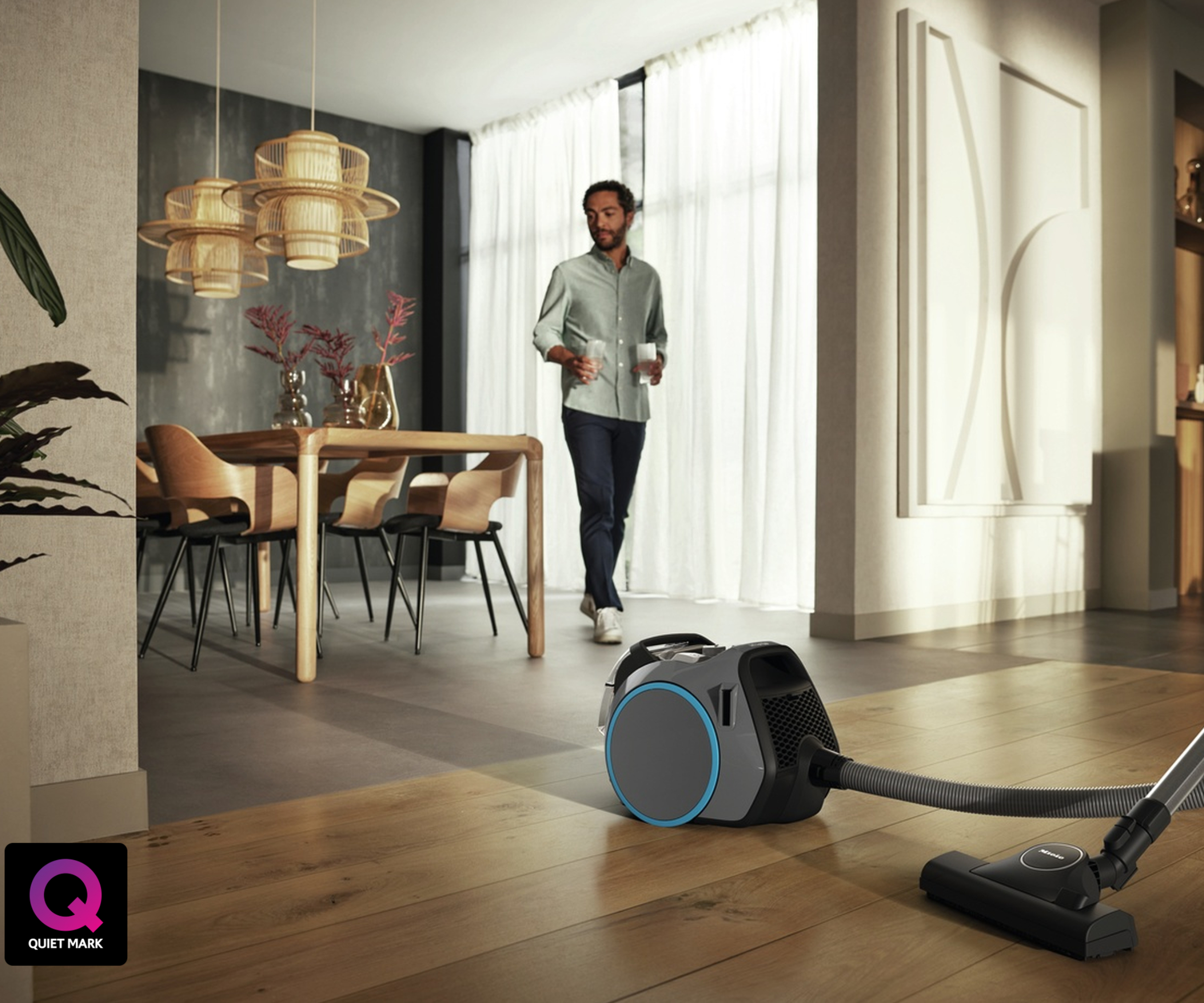 vaccuum on floor in open plan living room and dining room