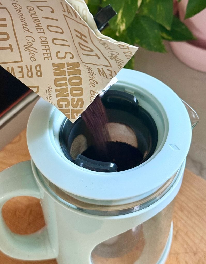 Adding Ground Coffee To Filter Of Cold Brew Maker