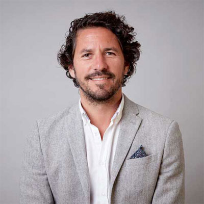 headshot of director of Wodar Michal Sammon