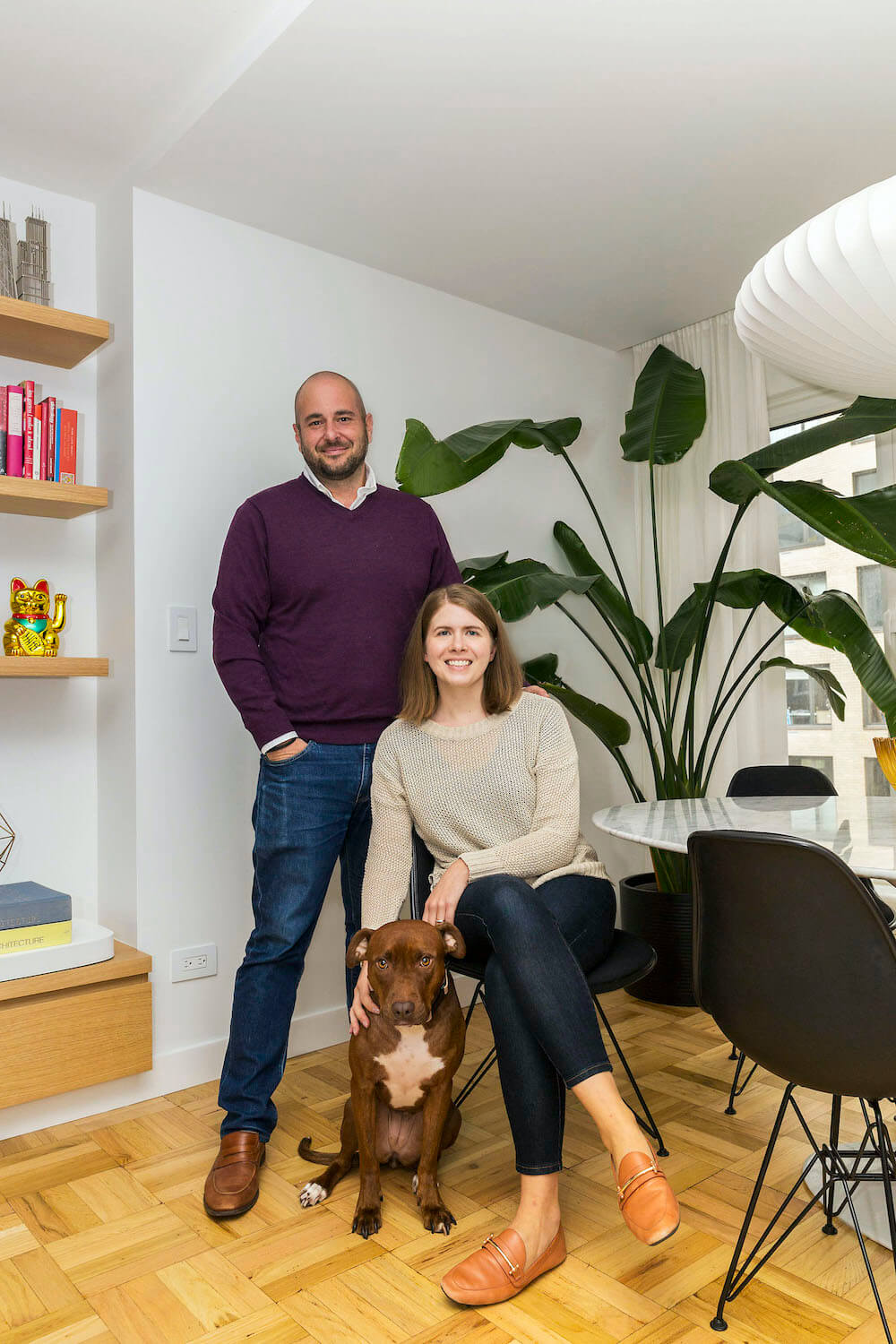 Portrait of the Sweeten homeowners and their dog