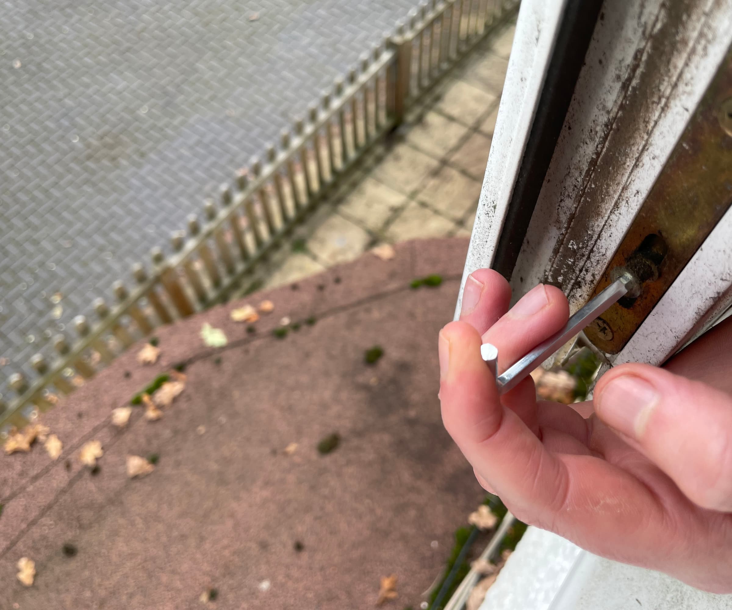 The inside seam of a uPVC window being turned with an Allen key