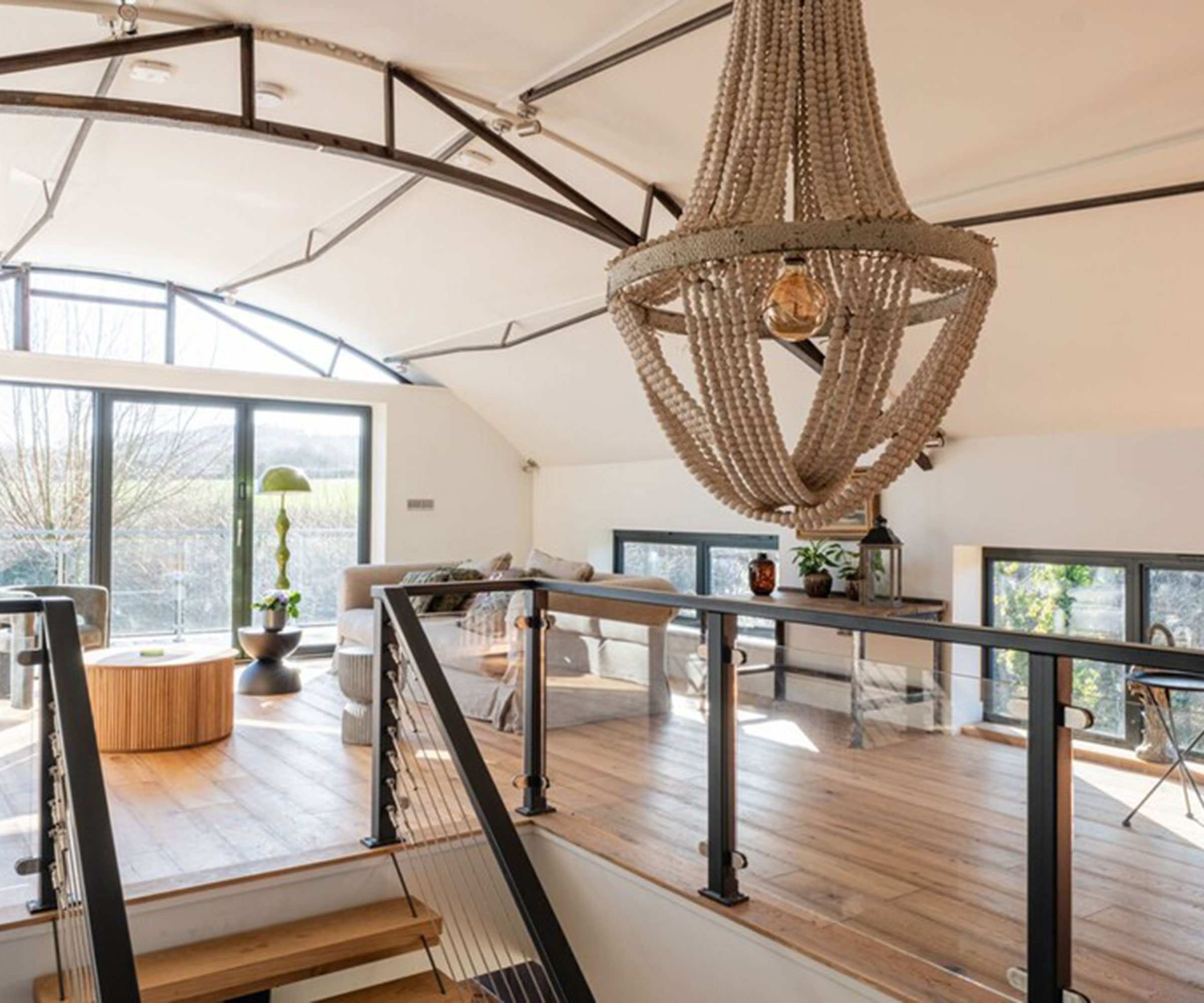 open plan living space with curved ceiling