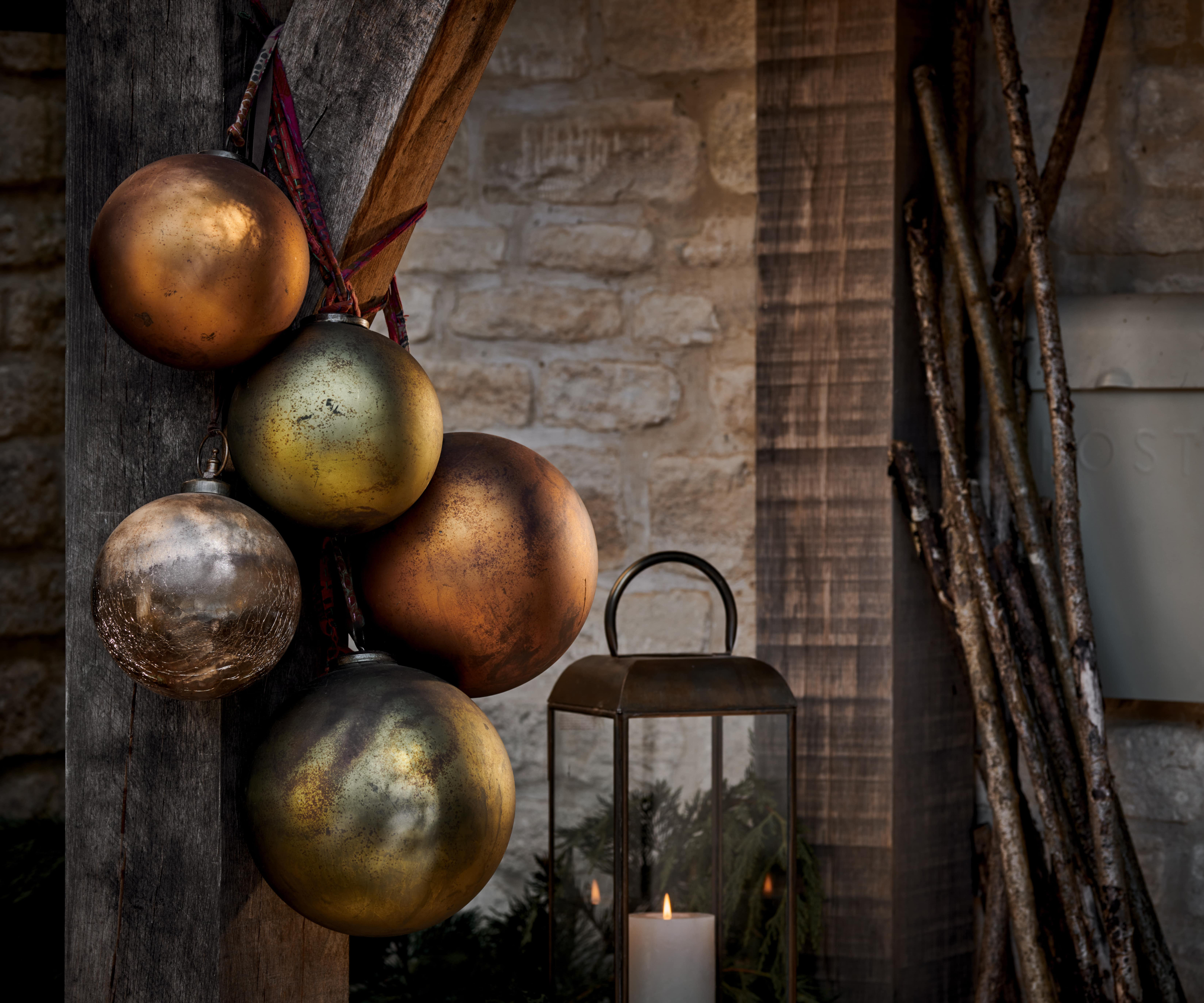 cluster of baubles hanging on oak frame porch