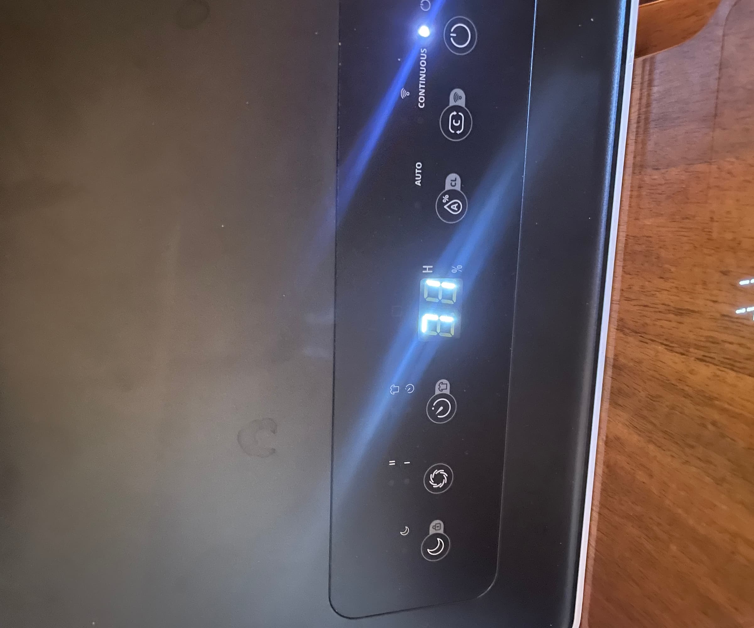 The top panel of a dehumidifier showing 71% humidity levels