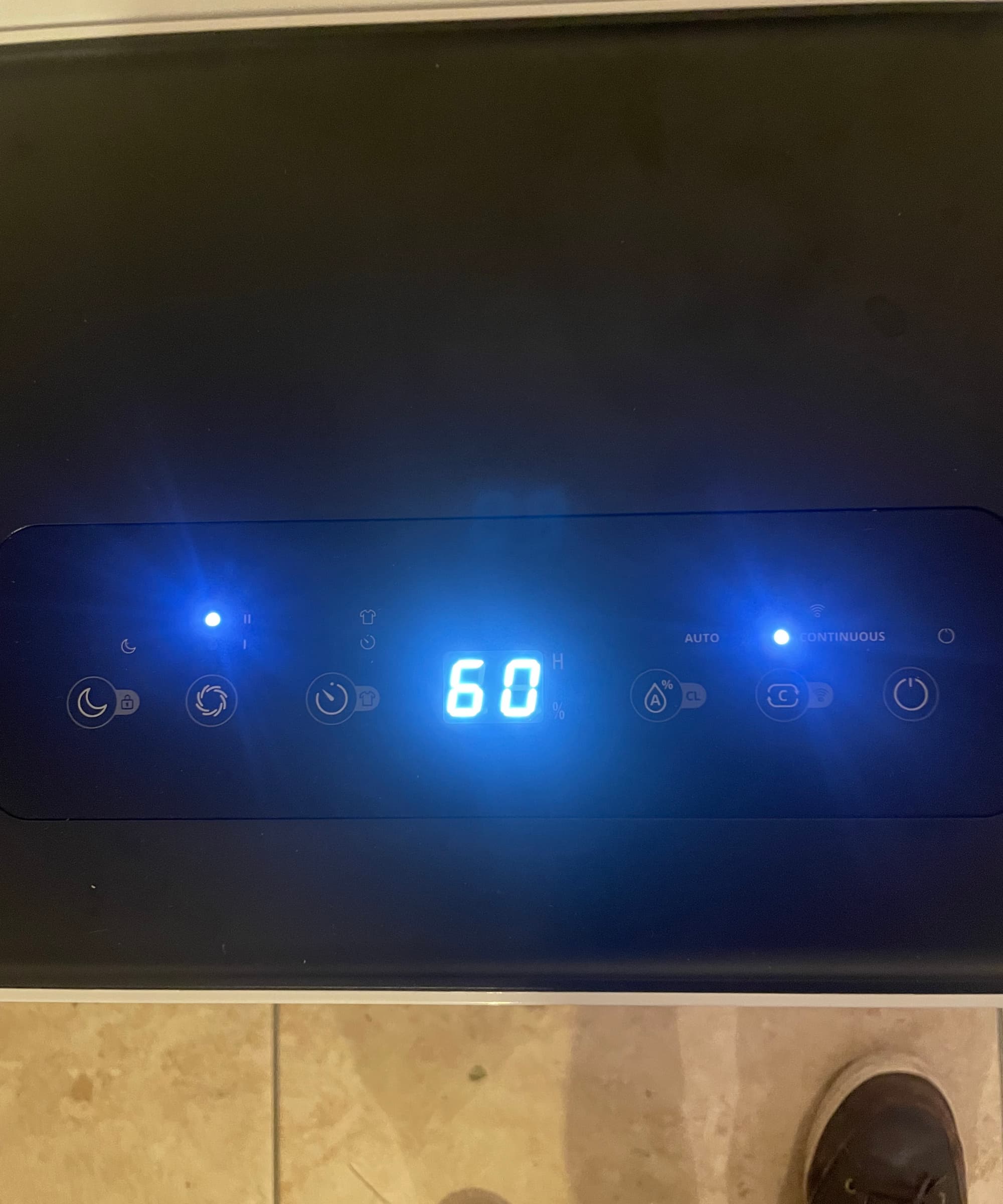 The top panel of a Duux Bora Dehumidifier showing 60% humidity levels