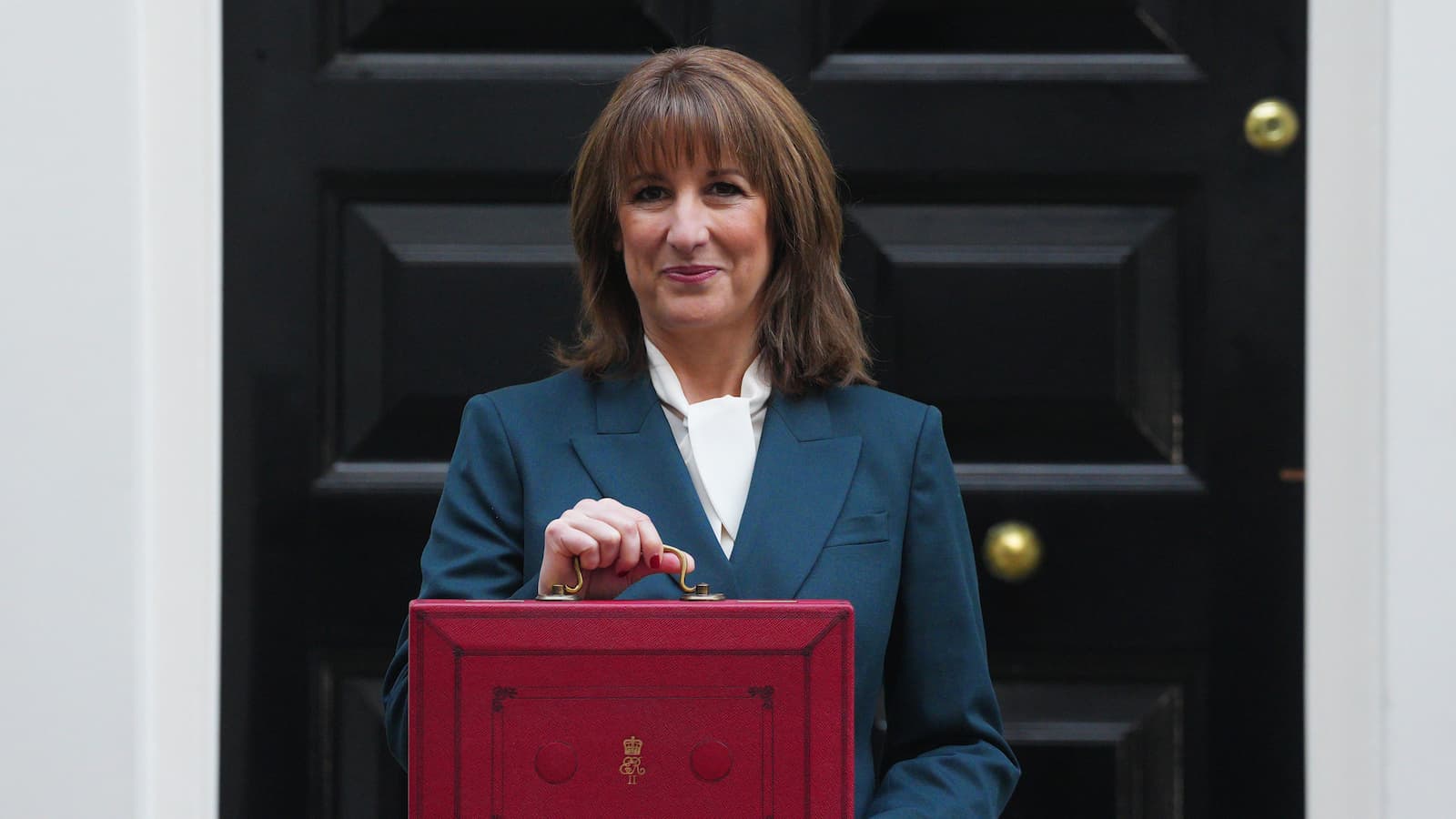 Chancellor of the Exchequer, Rachel Reeves, poses with the red Budget Box as she leaves 11 Downing Street to present the government's annual budget to Parliament