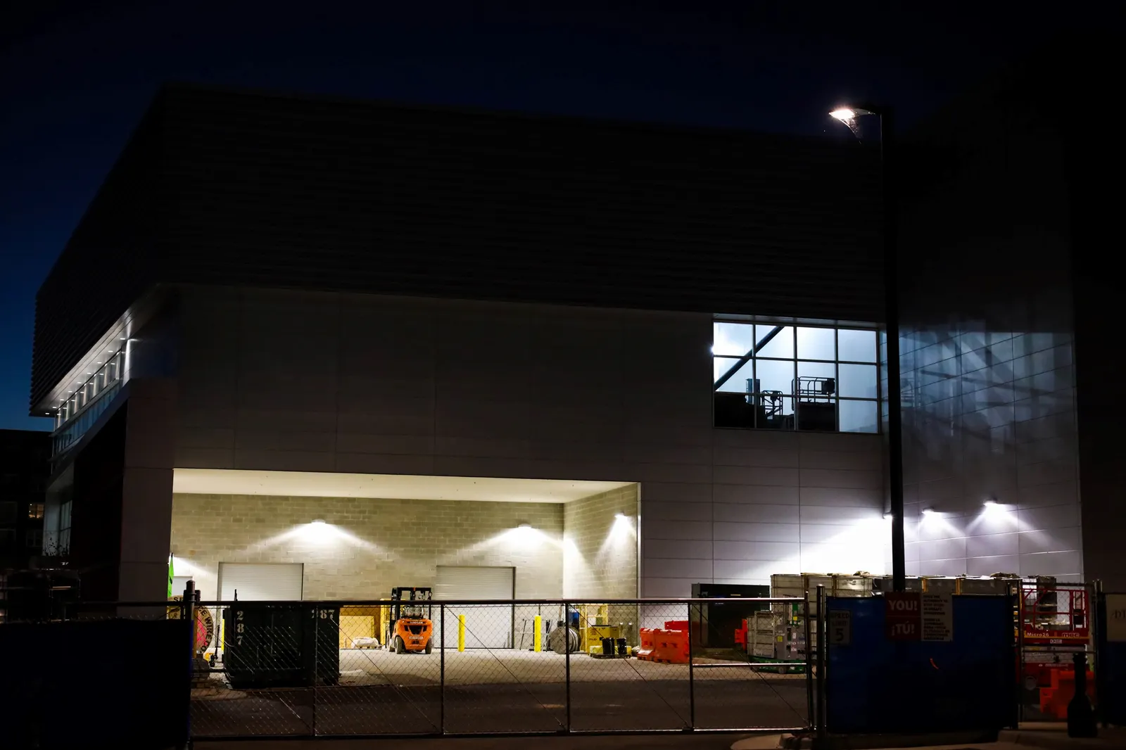 A data center under construction at night.