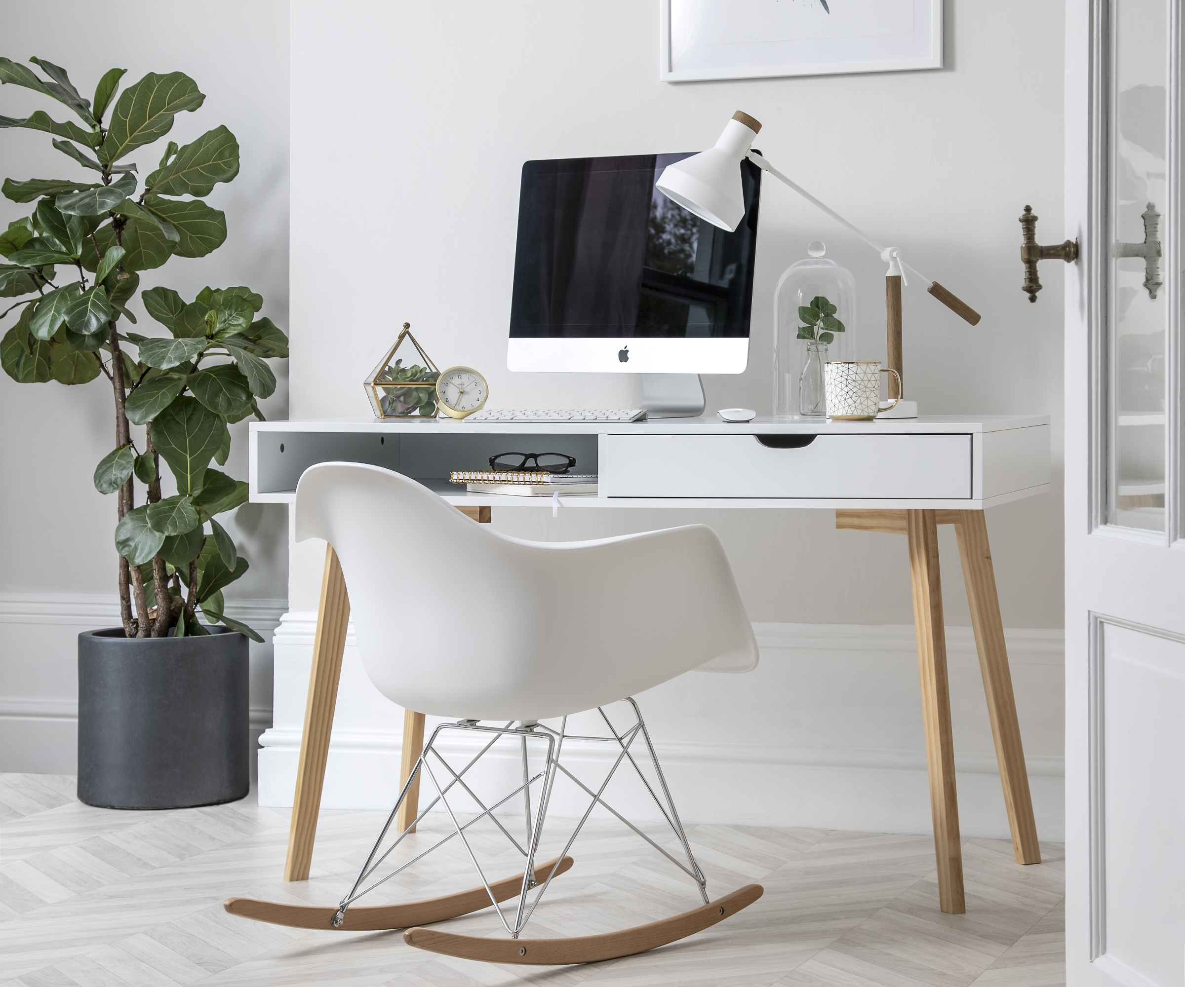 home office with white walls, white and wood desk and chair