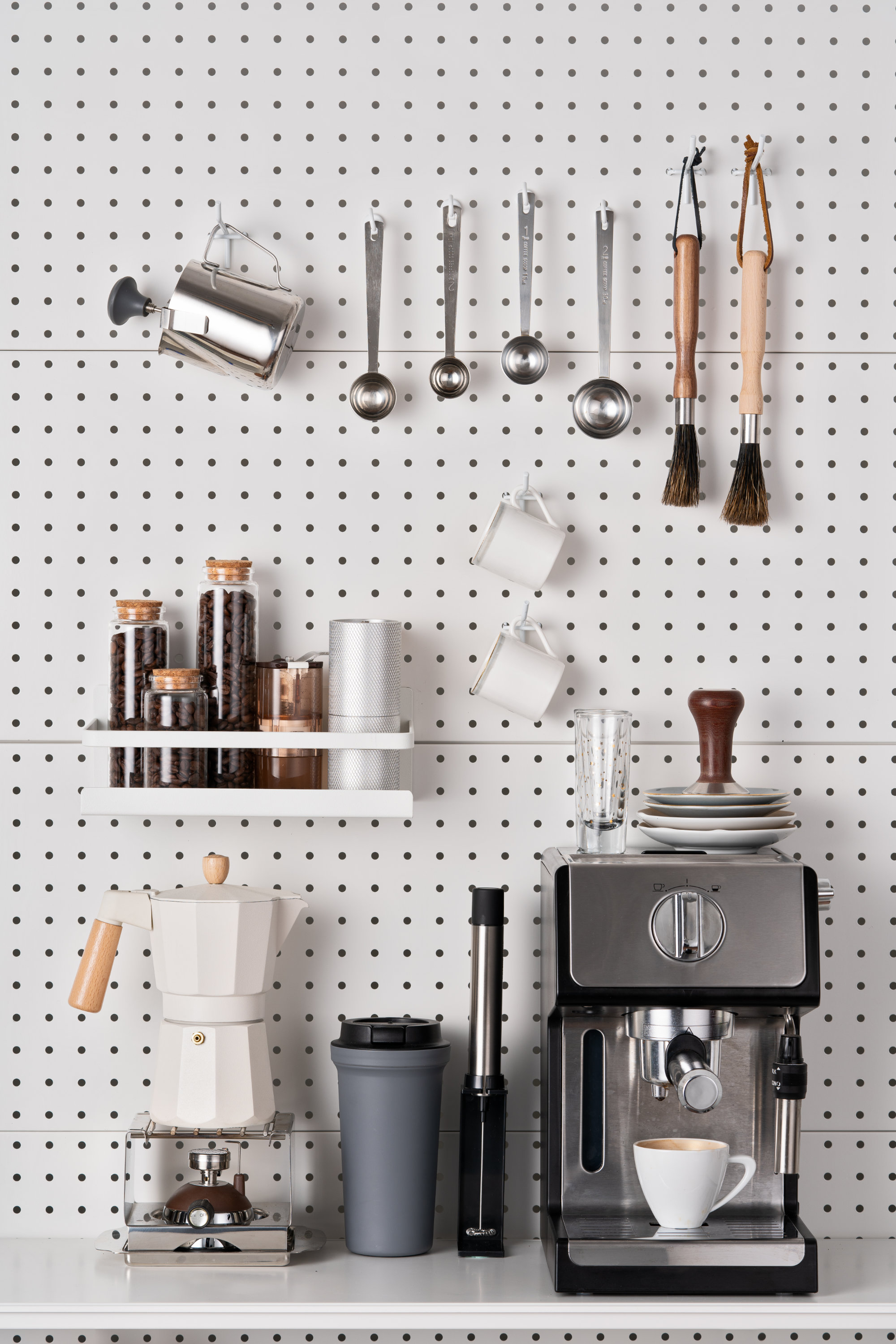 Espresso Coffee Maker and Accessories Knolling on White Colored Pegboard Background.
