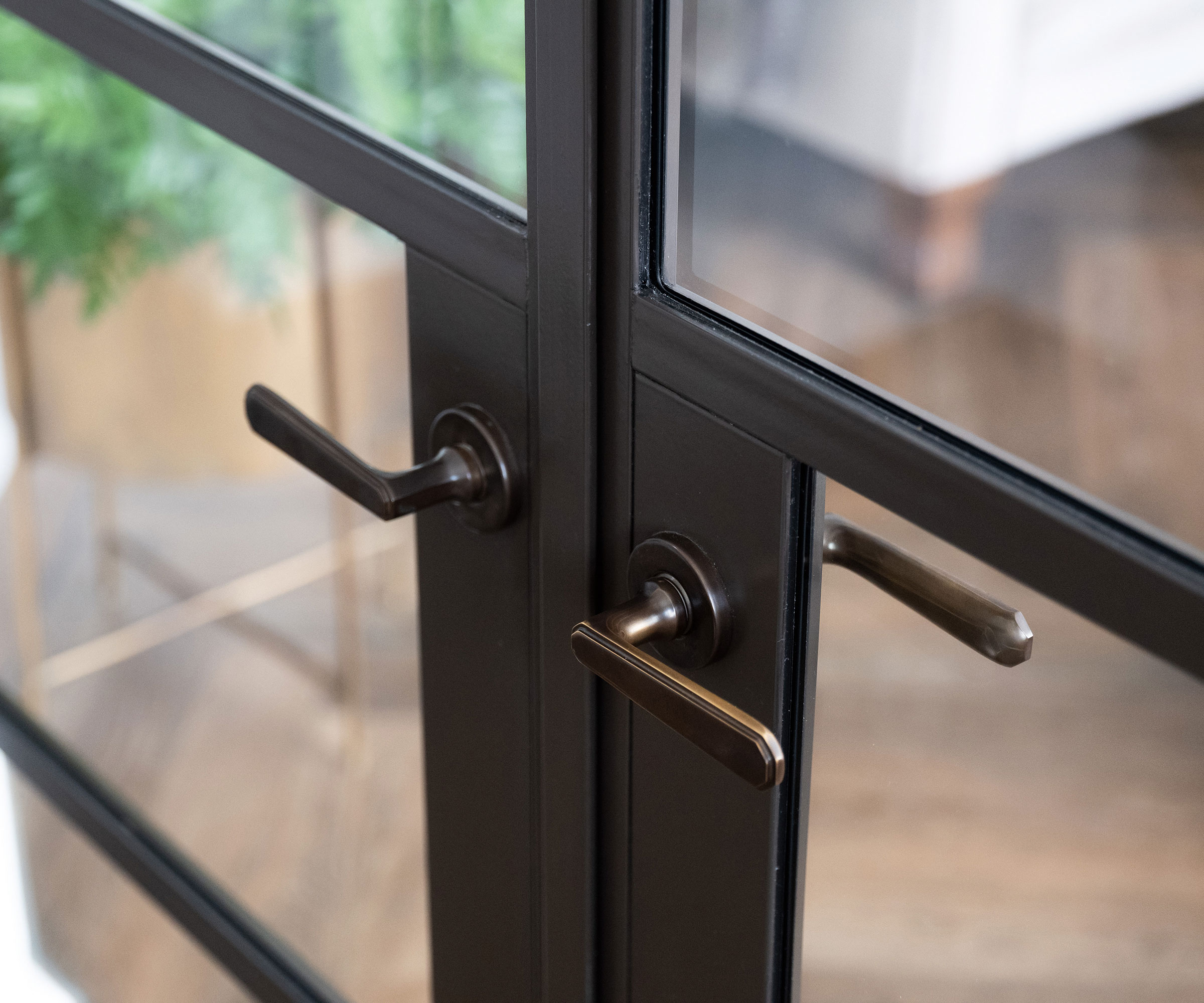 close up of a set of heritage-style French doors with metal door handles