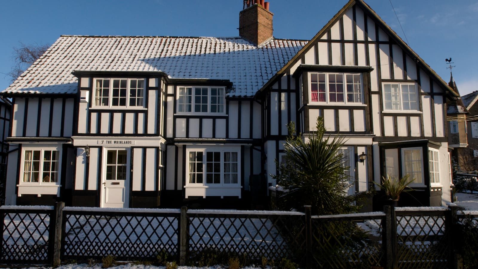 A Tudor house with snow on it