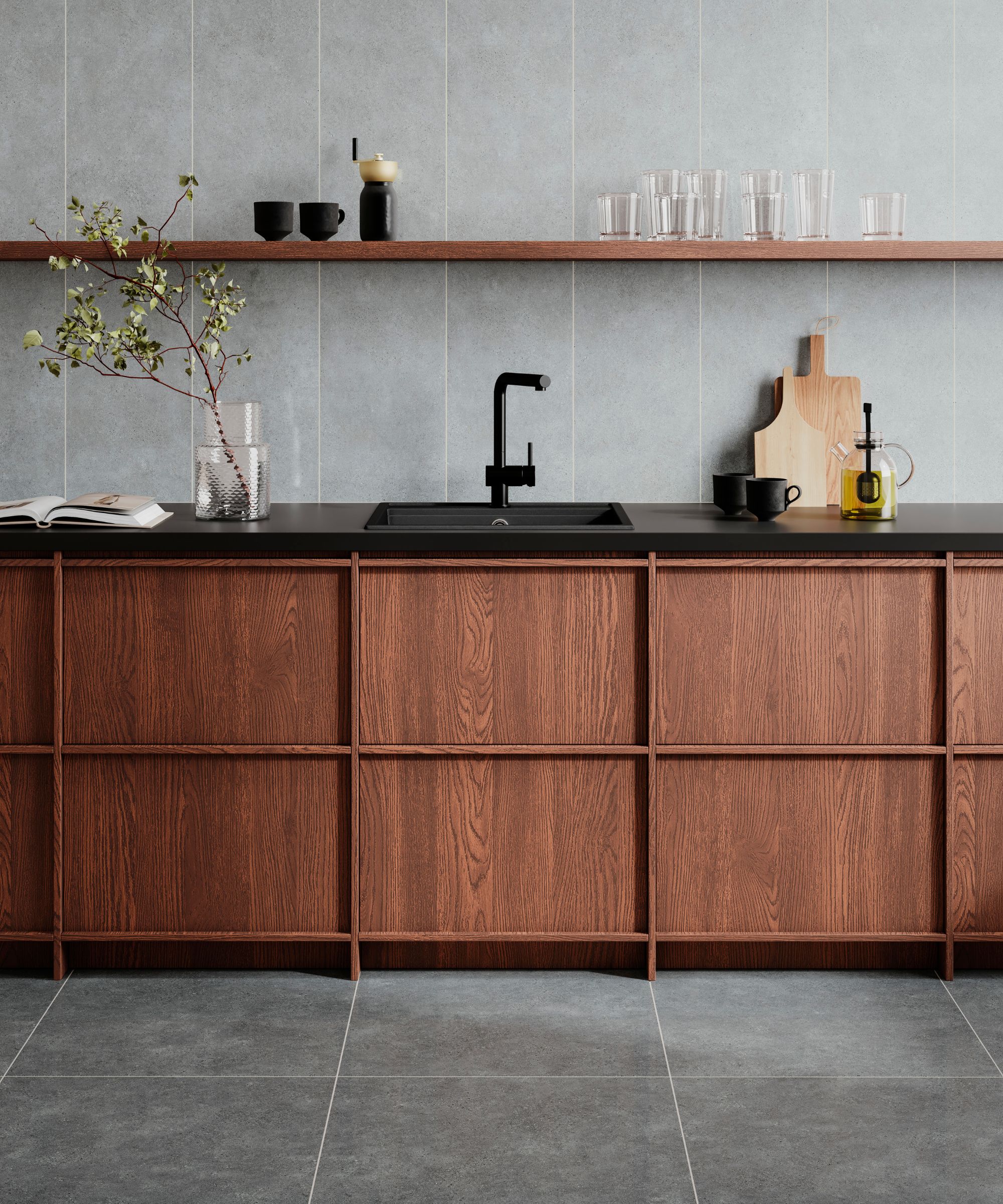 Minimal Japandi kitchen with warm wood cabinetry, matte black sink and tap, grey tiled splashback, open shelf with glassware and simple ceramics.