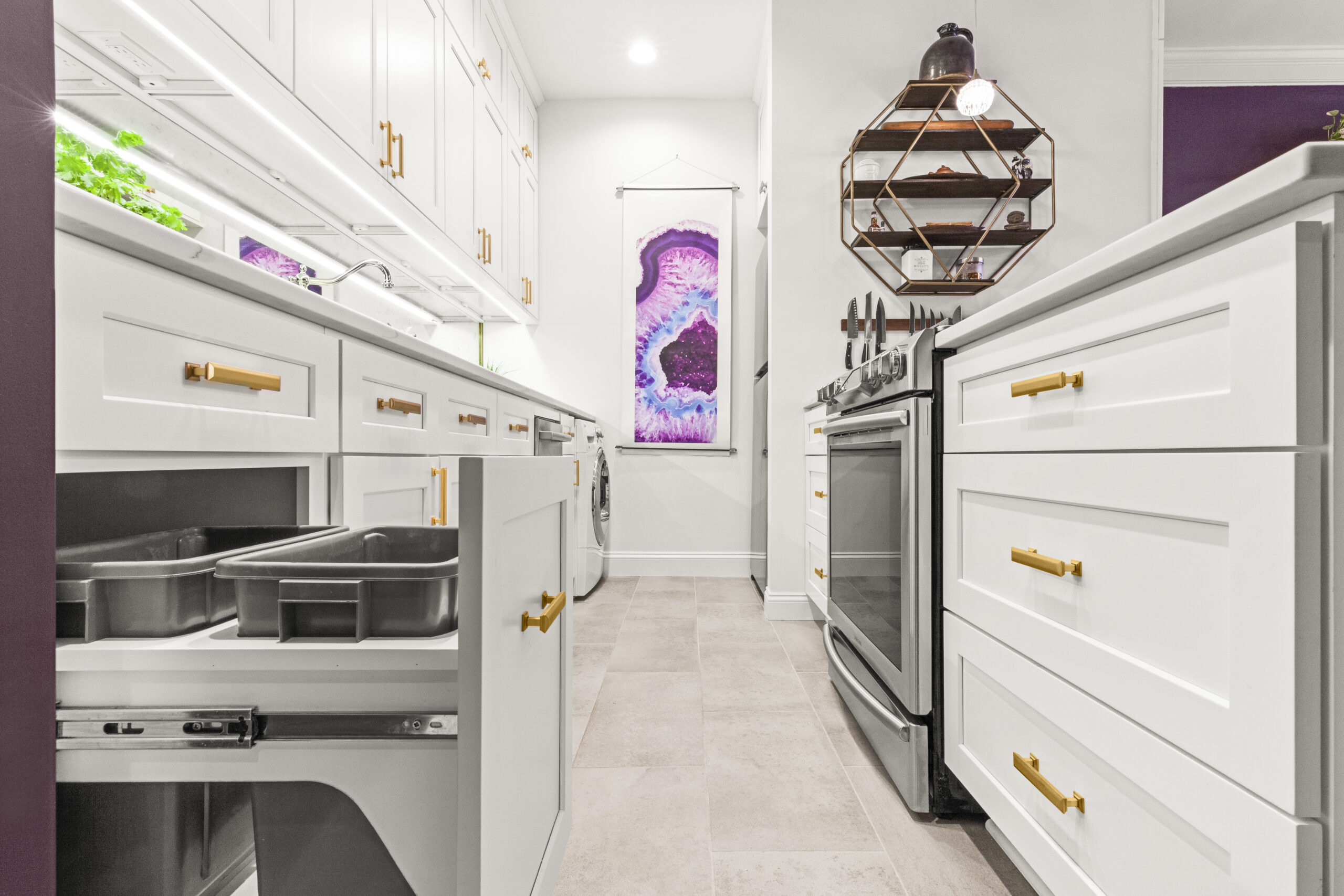Kitchen with white Shaker cabinets, pull-out storage, and tiled flooring